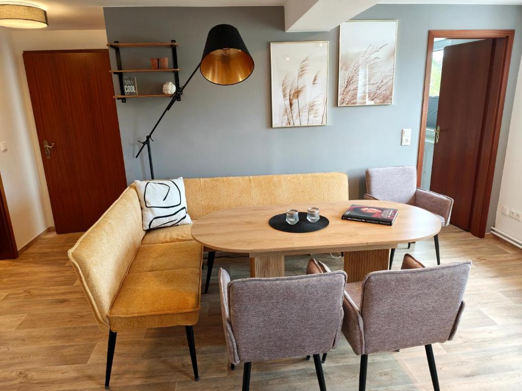 a dining room with a table and chairs at Gasthaus Harmonie in Malchow