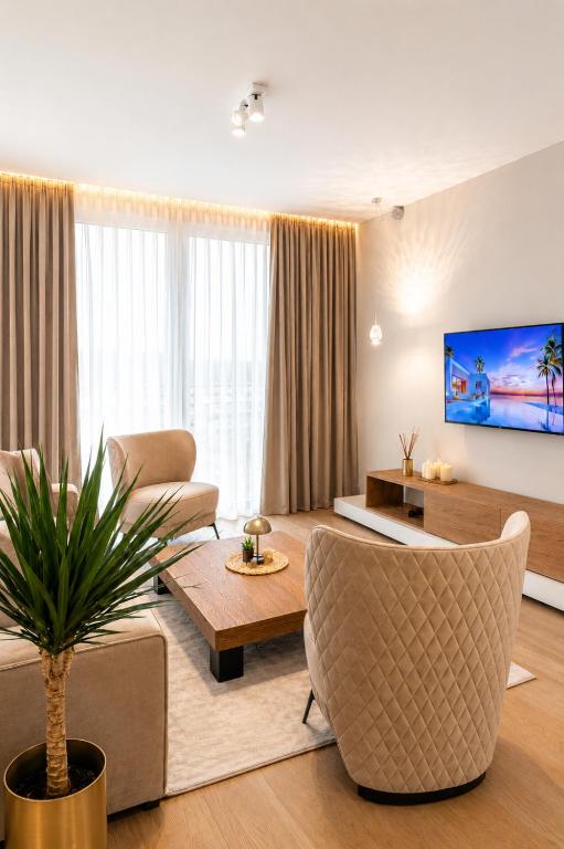 a living room with a couch and a table at Beograd na vodi-Belgrade Waterfront in Belgrade