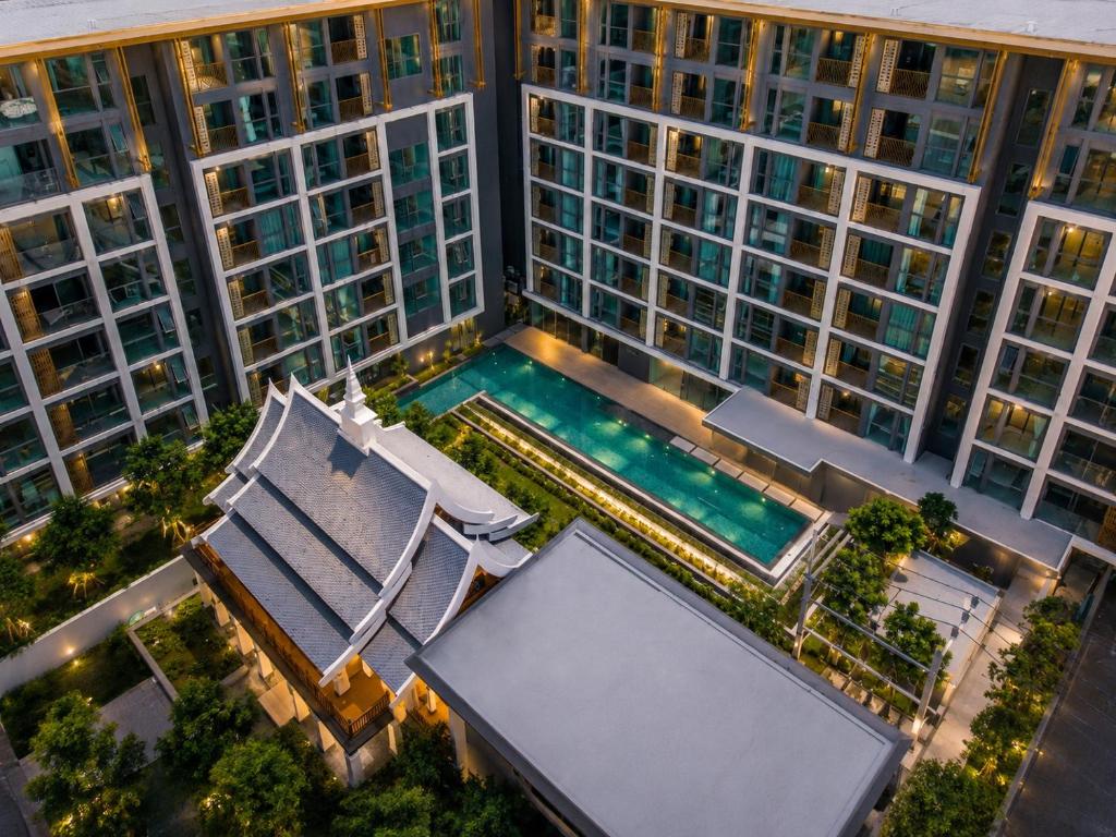 an overhead view of a large building with a swimming pool at Cozy 1 BR Bangtao Beach in Laguna Phuket