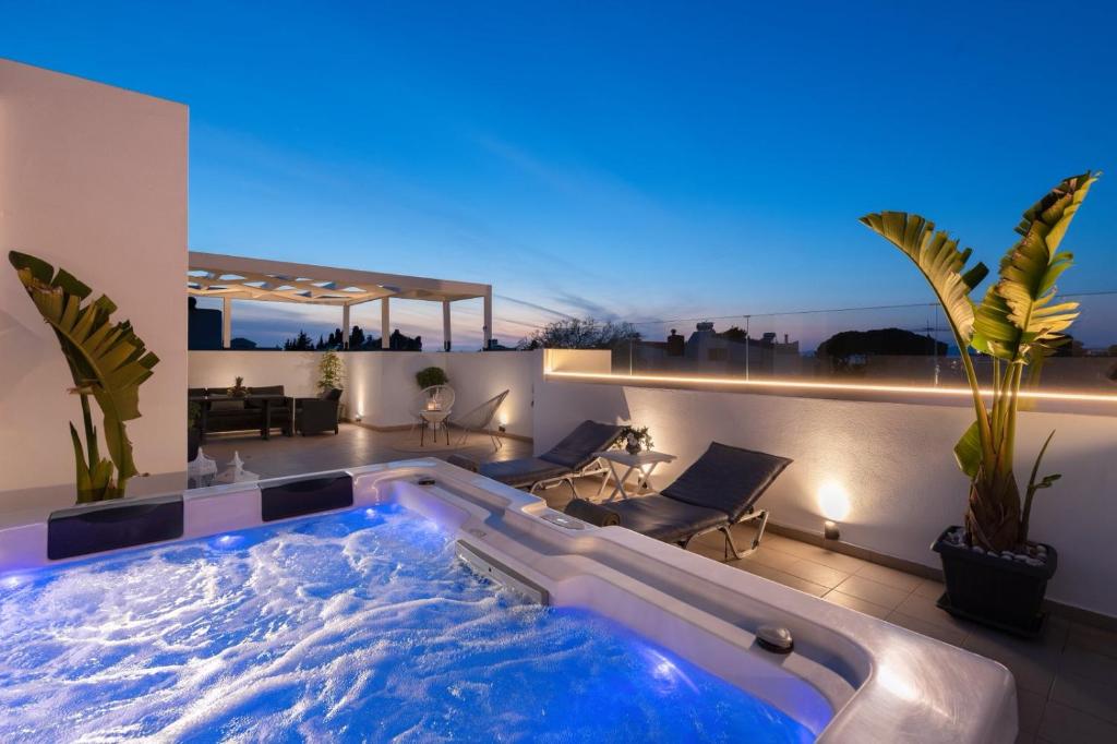 a jacuzzi tub in a living room at Sunny Palm Villa in Ialysos