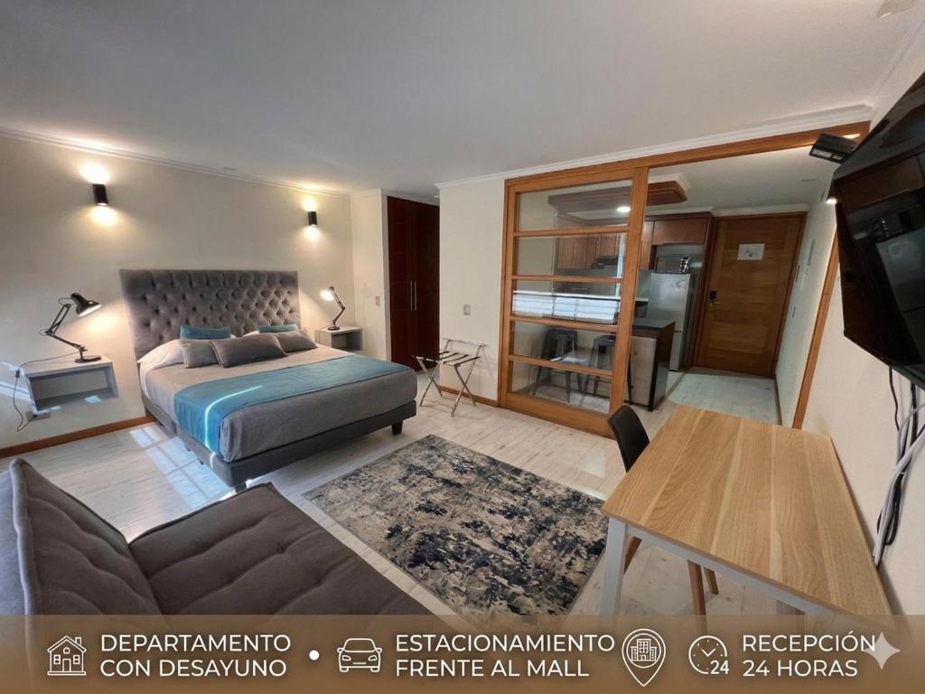 מיטה או מיטות בחדר ב-Apart Hotel Aragon Portal