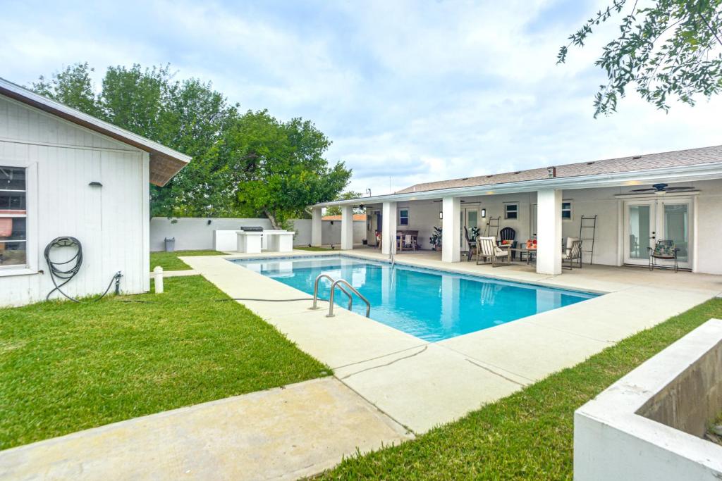 a swimming pool in the backyard of a house at Centrally Located Eagle Pass Home w/ Pool! in Eagle Pass
