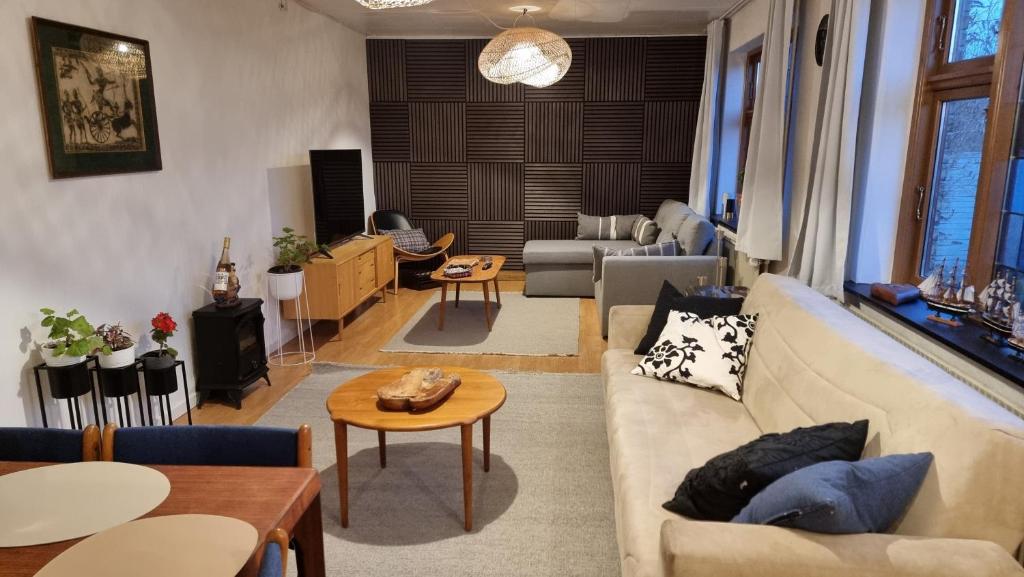 a living room with a couch and a table at Casa del Amor in Hyldtofte