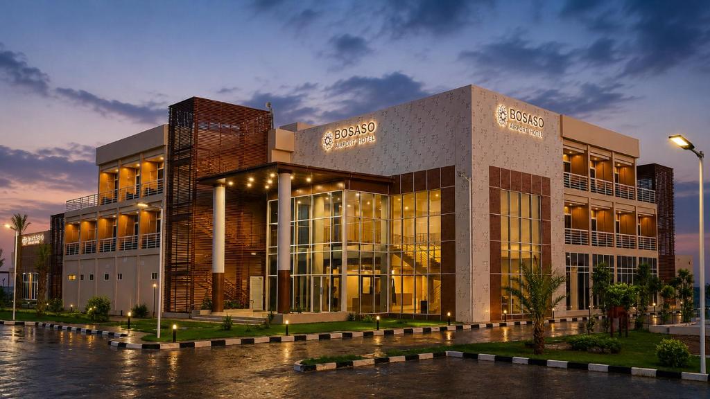 a large office building with a lit up facade at Bosaso Airport Hotel in El Ad