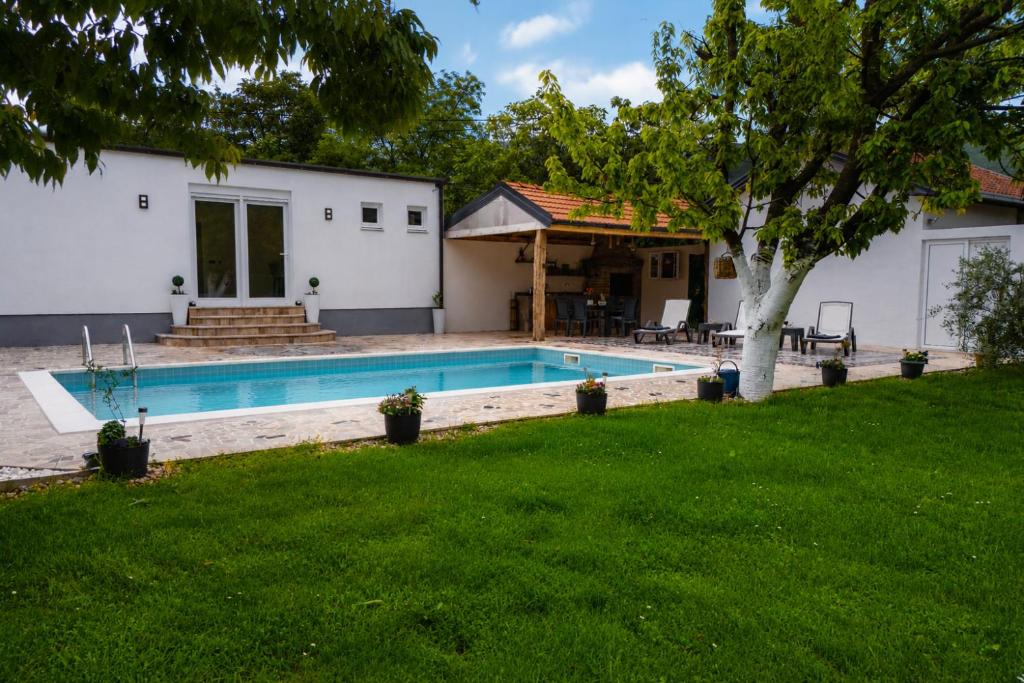 a house with a swimming pool in a yard at PIK Residence in Mostar