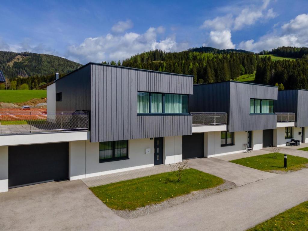 an aerial view of a building with mountains in the background at Pabstin in Sankt Lambrecht