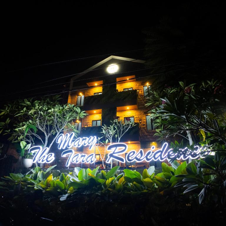 a sign that reads merry like tarzanres in front of a house at The Marytara Residence in Sawah