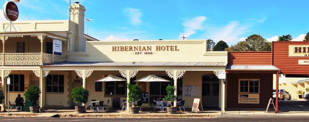 a building with a sign that reads harlememan hotel at Hibernian Hotel in Beechworth