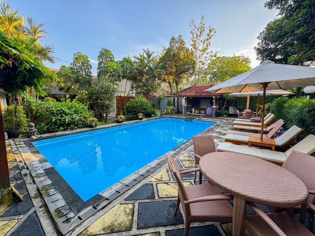 an image of a swimming pool in a house at Rumah Mertua Heritage in Yogyakarta