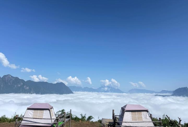 a group of tents on top of a field of clouds at Nongkhiaw Camping 360 c top mountain view in Nongkhiaw