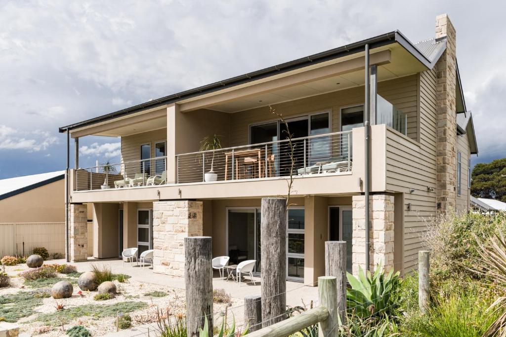 a house on the beach with a balcony at The Jetty, Port Willunga in Port Willunga