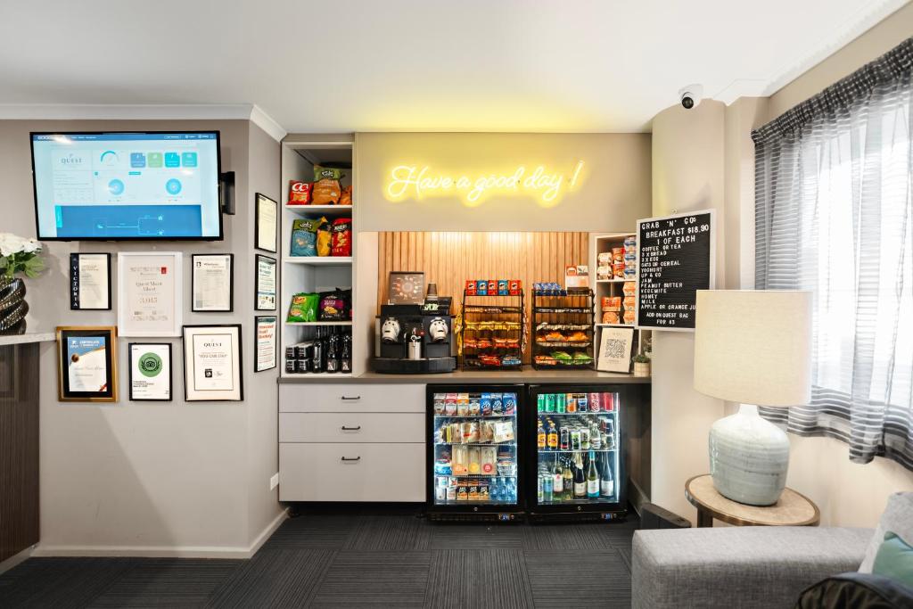 a grocery store with a refrigerator in a room at Quest Mont Albert in Box Hill