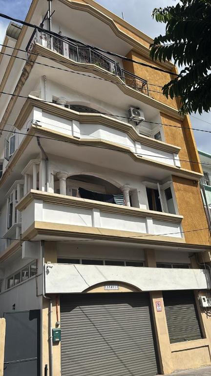 a building with an awning on the side of it at Green Peak Stay in Port Louis