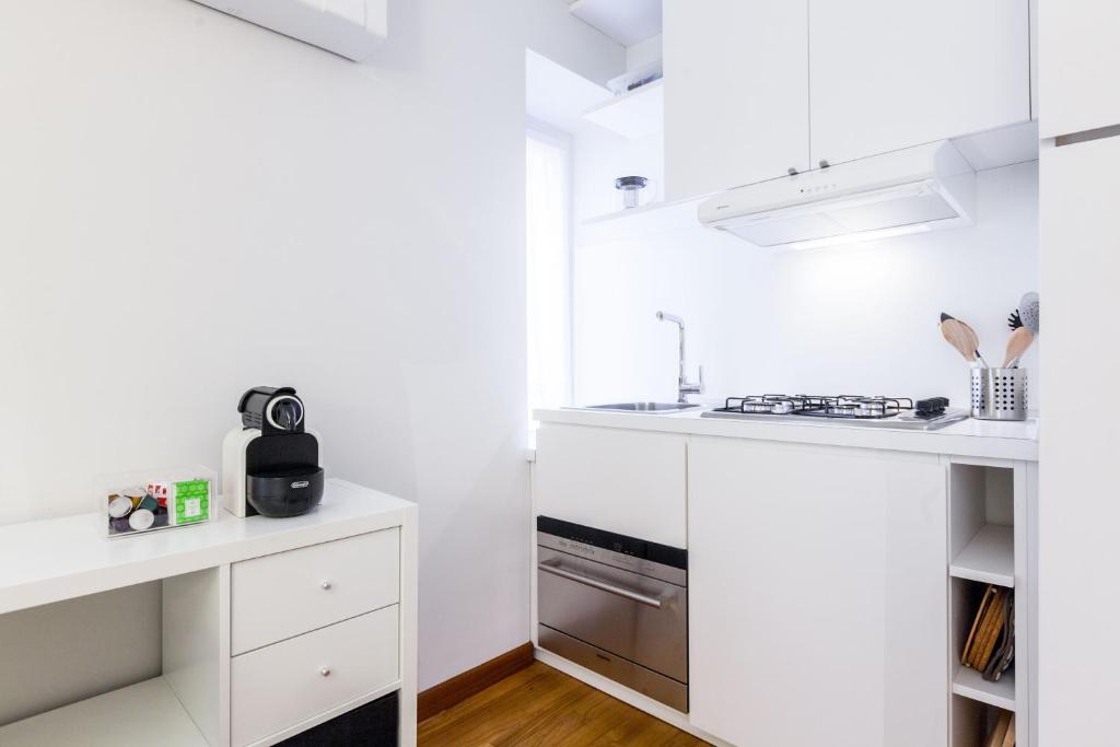Kuchyňa alebo kuchynka v ubytovaní easyhomes - Spiga Suite