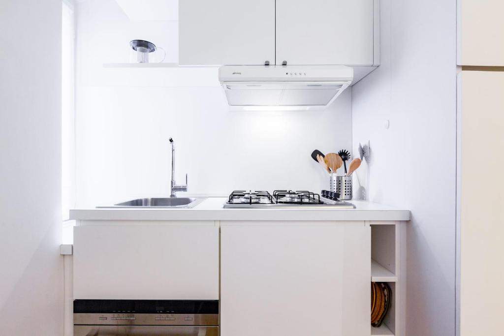Kuchyňa alebo kuchynka v ubytovaní easyhomes - Spiga Suite