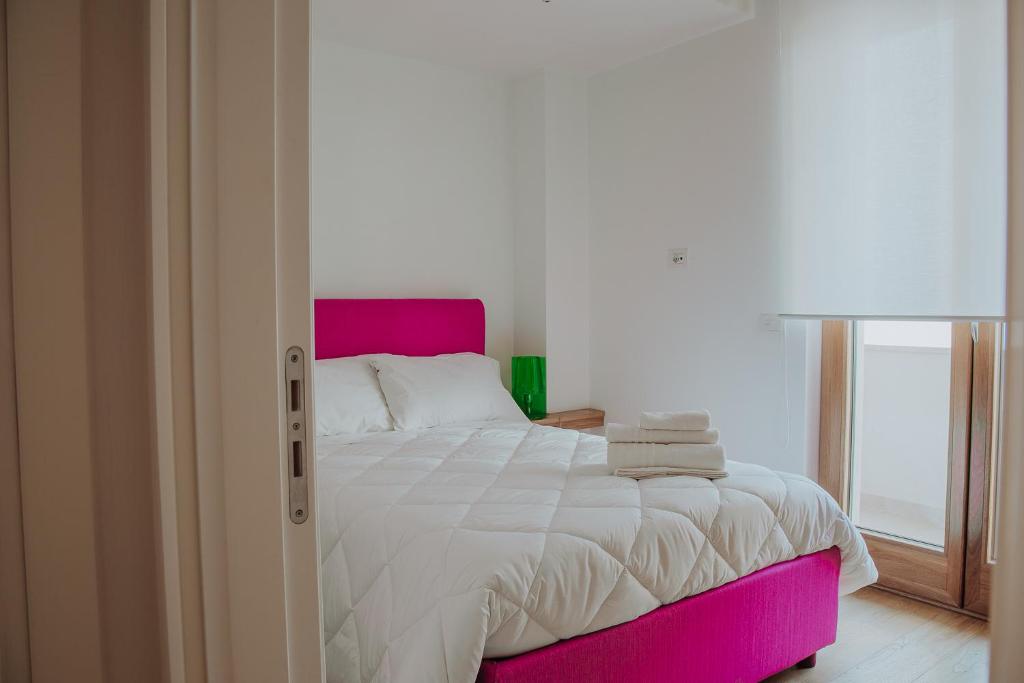 Postel nebo postele na pokoji v ubytování New Suite Lecce