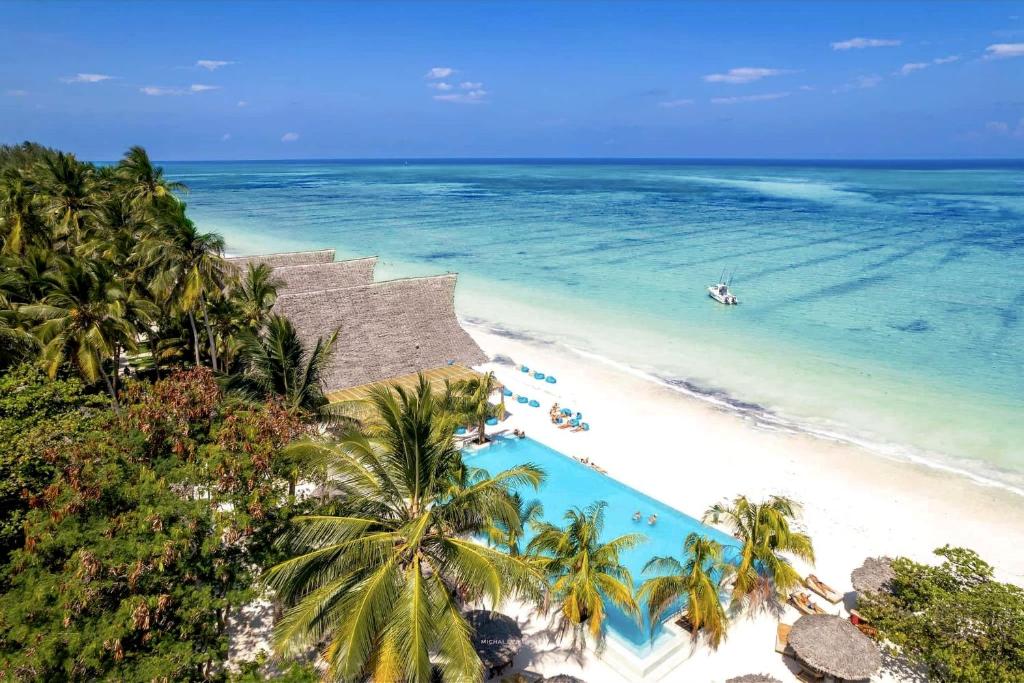 an aerial view of a beach with a swimming pool at NDAME Paje Hotel in Paje