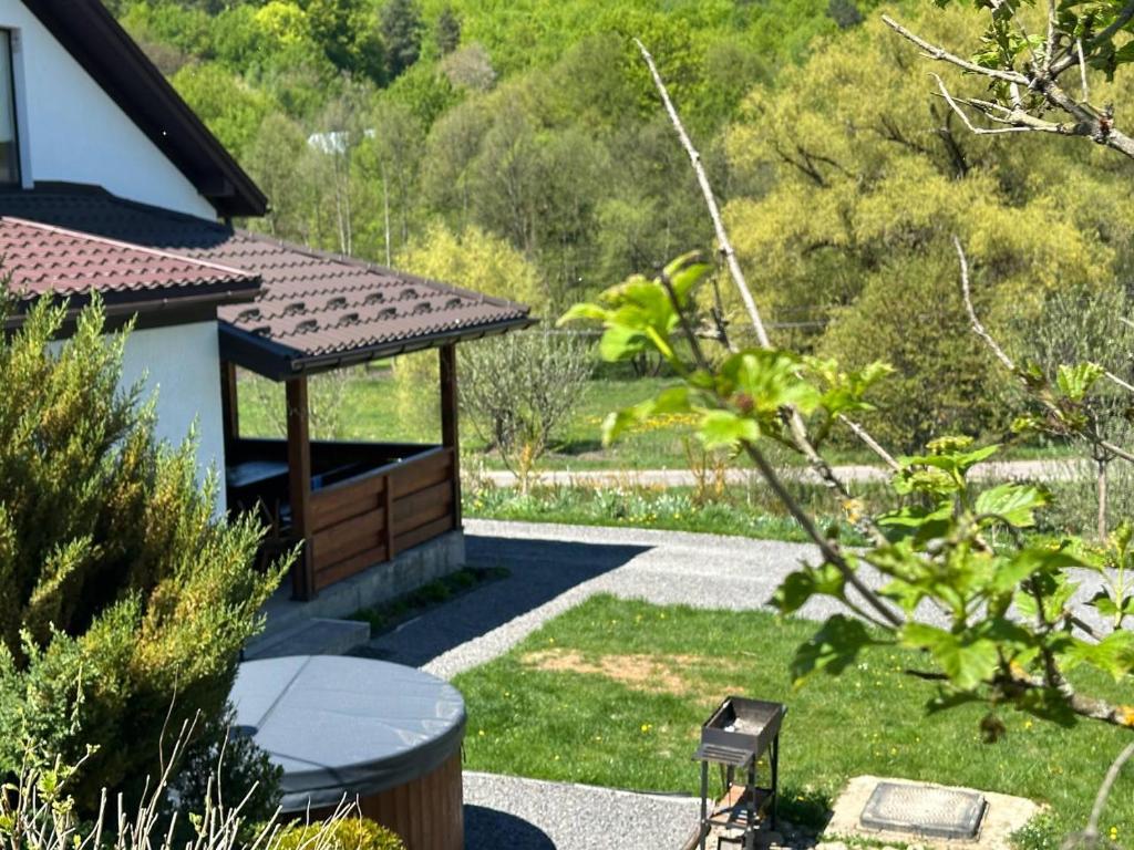 a garden with a gazebo and a table at Майдан house in Maidan Village