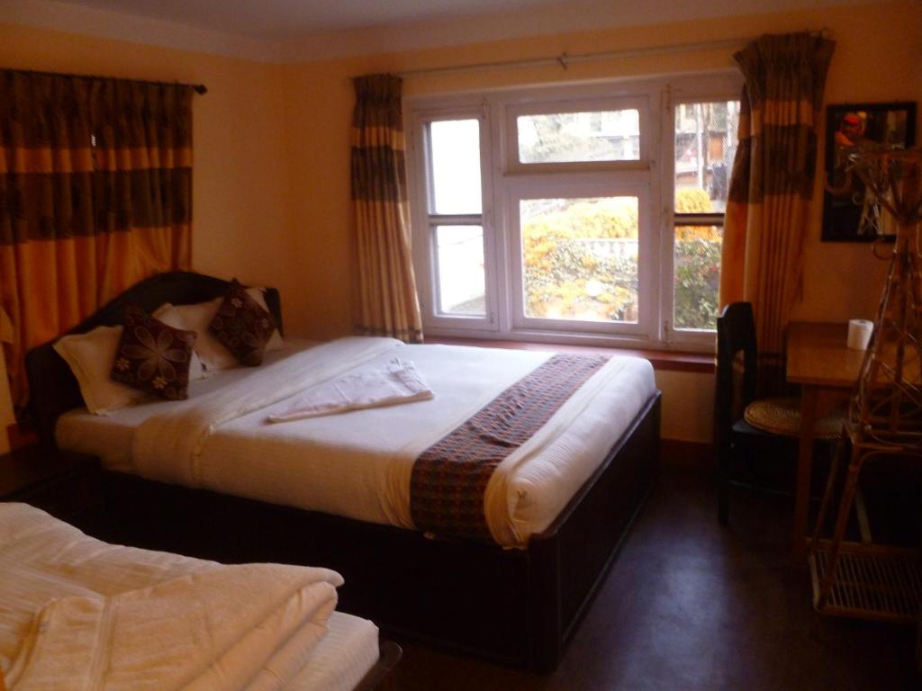 Postel nebo postele na pokoji v ubytování Andes House