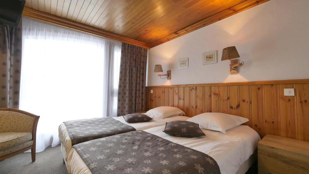 Postel nebo postele na pokoji v ubytování L'Annexe
