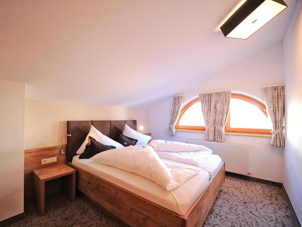 Postel nebo postele na pokoji v ubytování Hotel Röck Garni