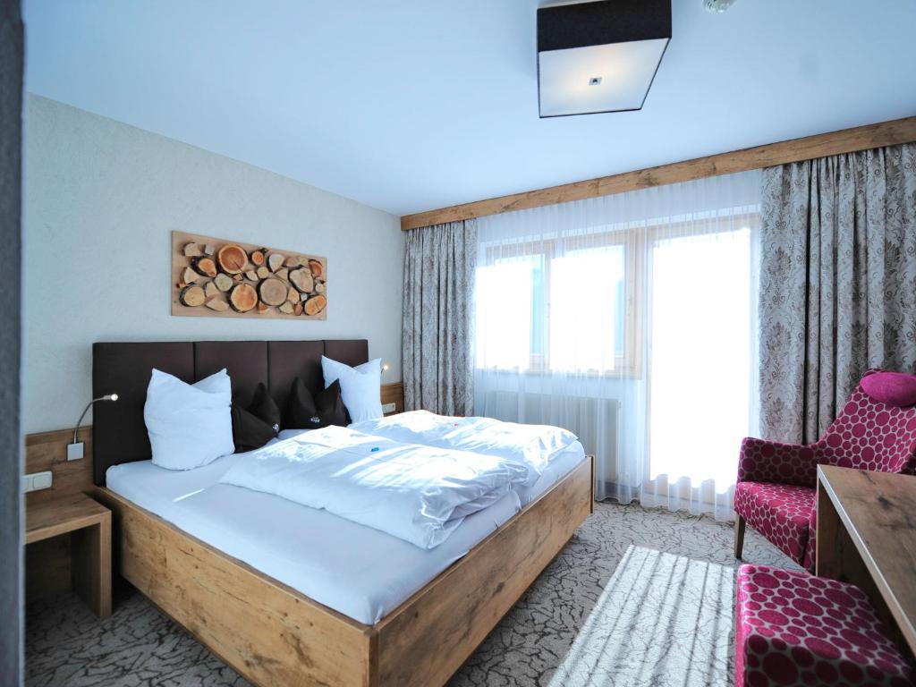 Postel nebo postele na pokoji v ubytování Hotel Röck Garni