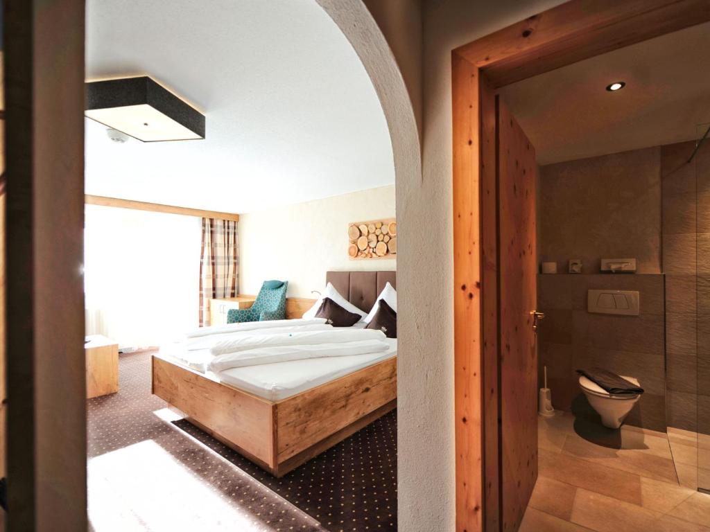 Postel nebo postele na pokoji v ubytování Hotel Röck Garni