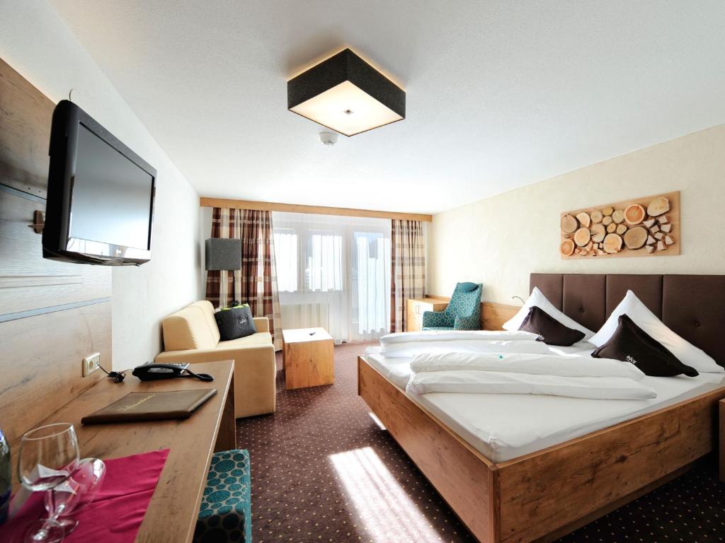 Postel nebo postele na pokoji v ubytování Hotel Röck Garni