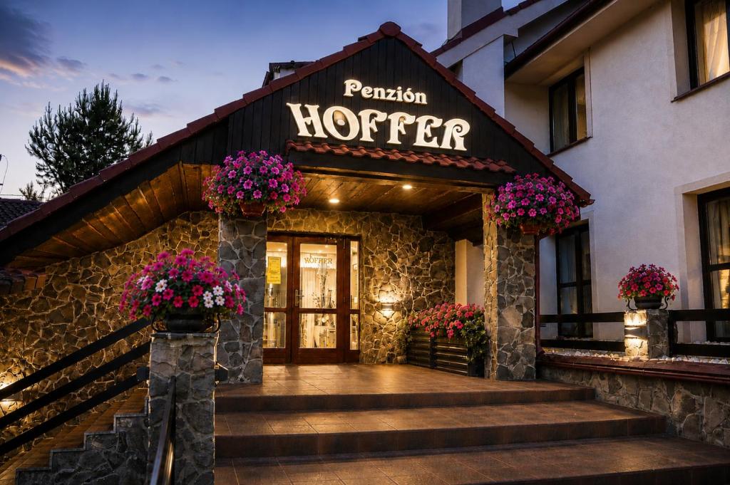 a hotel entrance with a sign for a hotel at Penzión Hoffer in Nitra