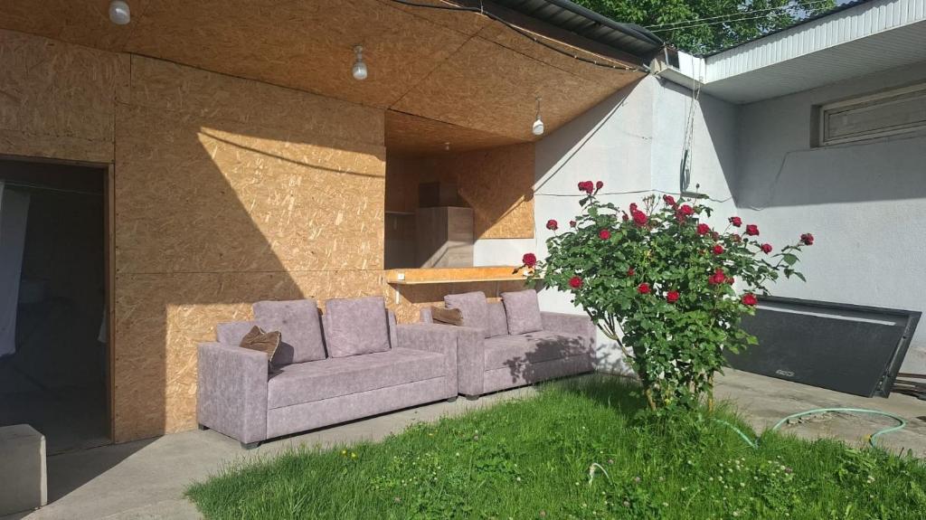 a couple of couches sitting in a yard at Star Zvartnots Hotel in Pʼarakʼar