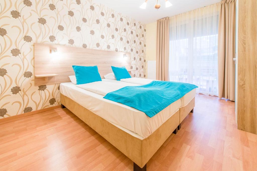 Posteľ alebo postele v izbe v ubytovaní Nova Apartments