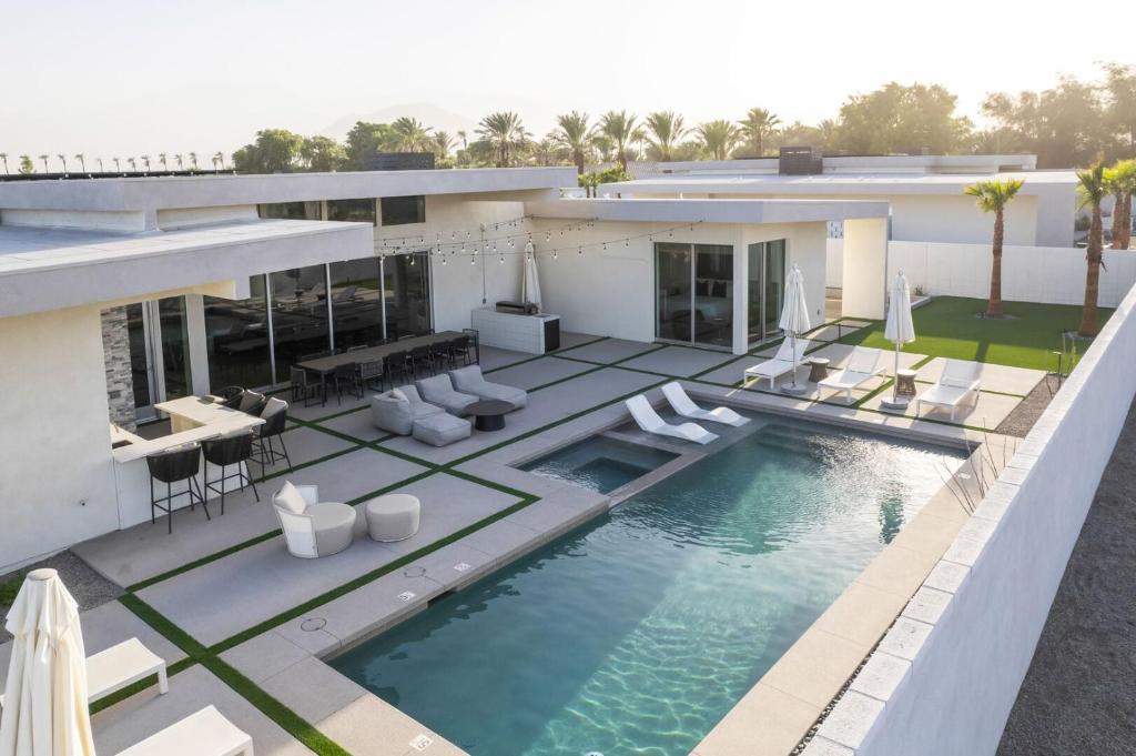 an aerial view of a house with a swimming pool at Mercury @ Elemento49 - Pool Spa - Sleeps 16 in Indio
