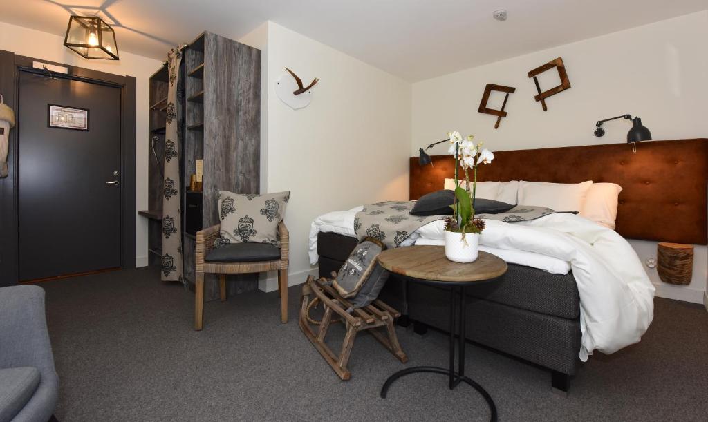 Postel nebo postele na pokoji v ubytování Hotel Mezzo