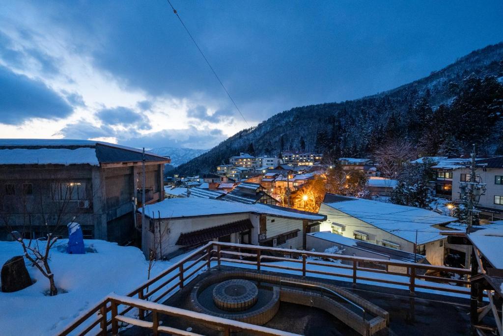 a view of a town in the snow at night at yutori-nozawa in Nozawa Onsen