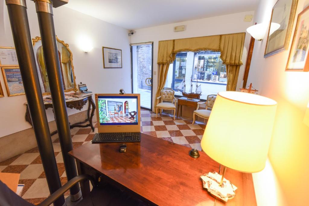 TV a/nebo společenská místnost v ubytování Albergo Casa Peron