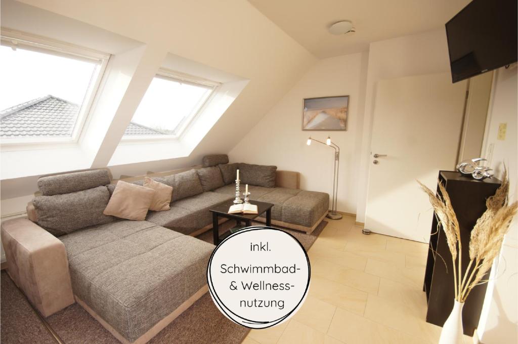 a living room with a couch and a table at Ferienwohnung Feldblick in Grömitz