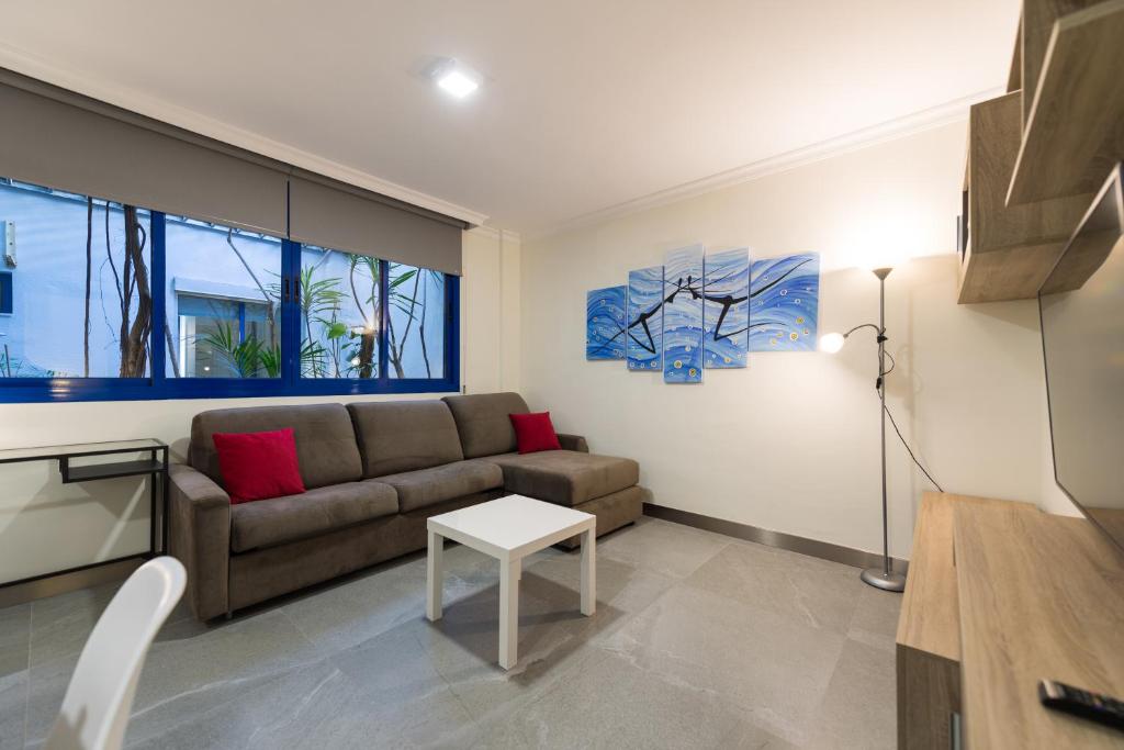 A seating area at Suites Garden Apartamento 15
