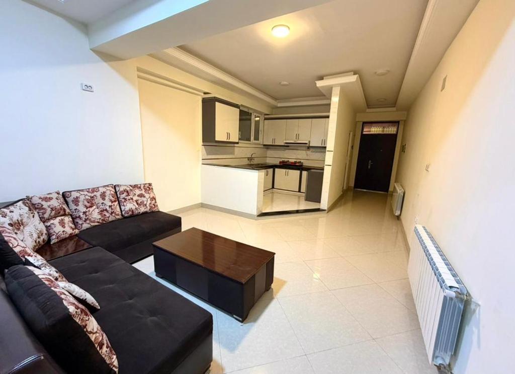 a living room with a couch and a table at Gulbahar Residences in Kabul