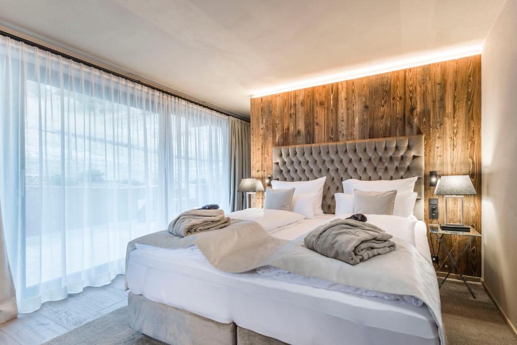 Postel nebo postele na pokoji v ubytování Hotel Montchalet