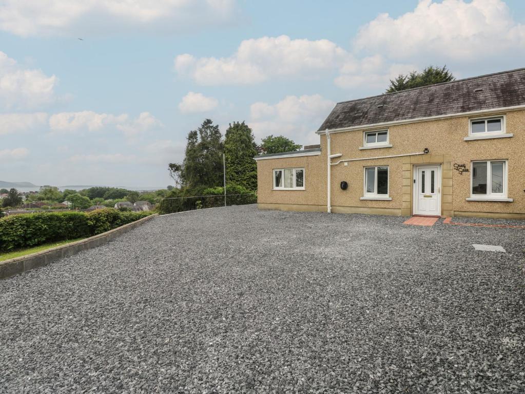 an empty driveway in front of a house at Graig Goch in Burry Port