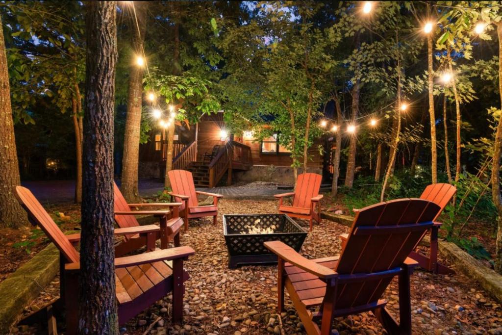 a group of chairs sitting in a park at night at Awesome Adventures By Avada Properties in Sevierville