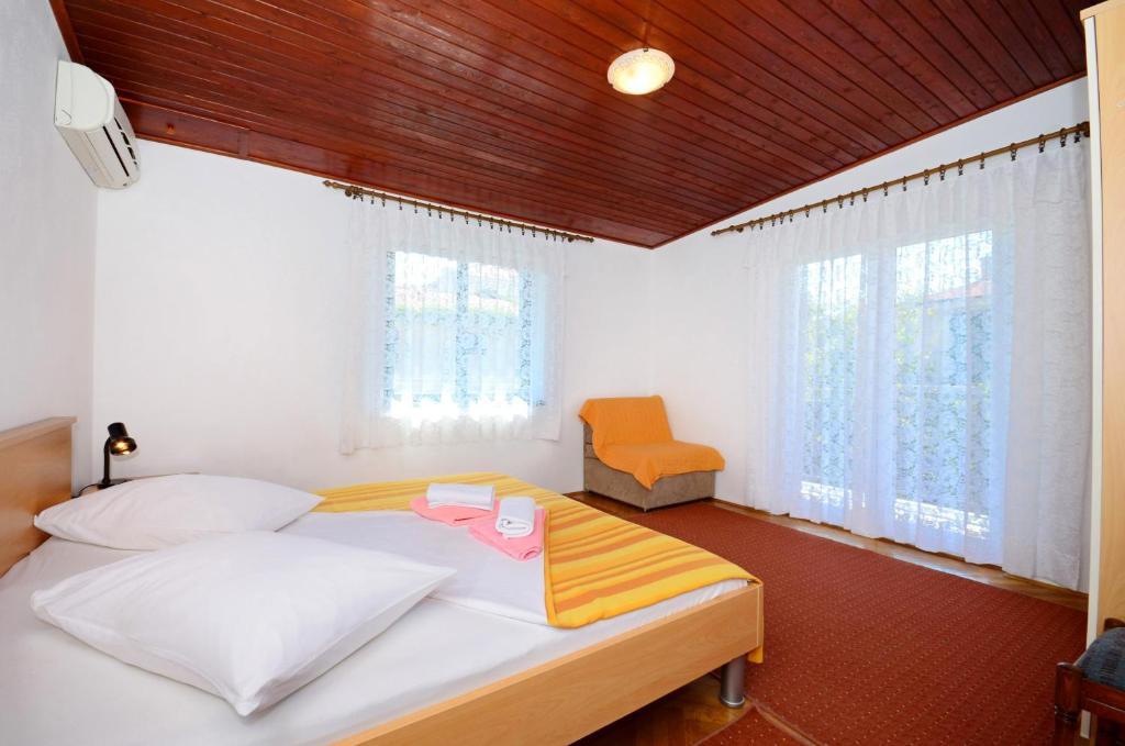 Posteľ alebo postele v izbe v ubytovaní Apartments Joško