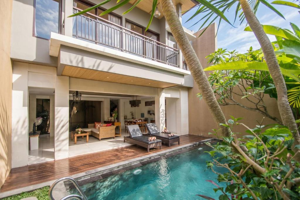 an image of a villa with a swimming pool at Kamajaya Villas in Ubud