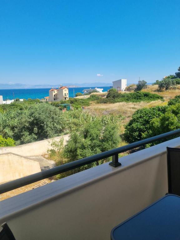 a view of the ocean from a balcony at Irides Apartments in Megalochori