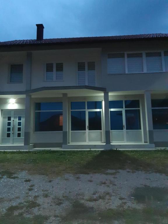 a house with large windows in front of it at air&wizz II in Dubrave Gornje