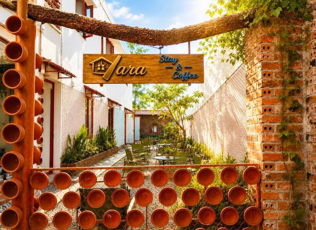 a sign that says the julaarma on a building at YARA - Stay & Coffee in Mỹ Ðuc