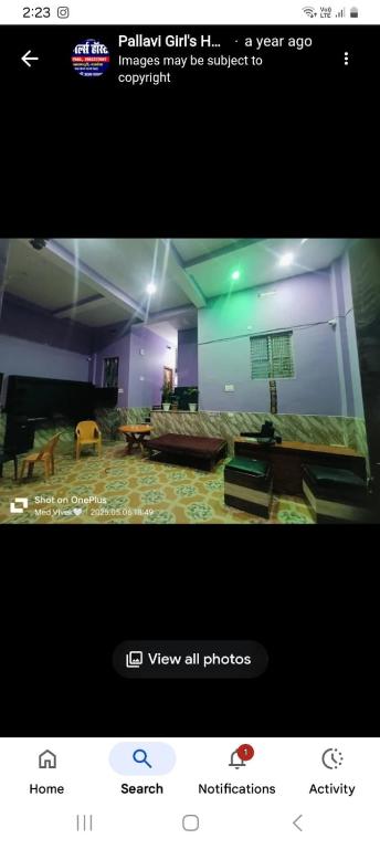 a picture of a living room with a couch at Pallavi girl hostel in Laheria Sarāi