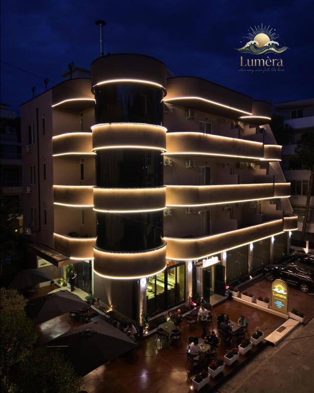 a building with lights on it at night at Lumera Hotel in Durrës