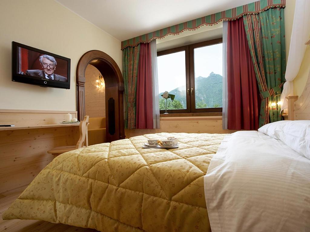 Postel nebo postele na pokoji v ubytování Giorgio e Flora Ristorante e Locanda