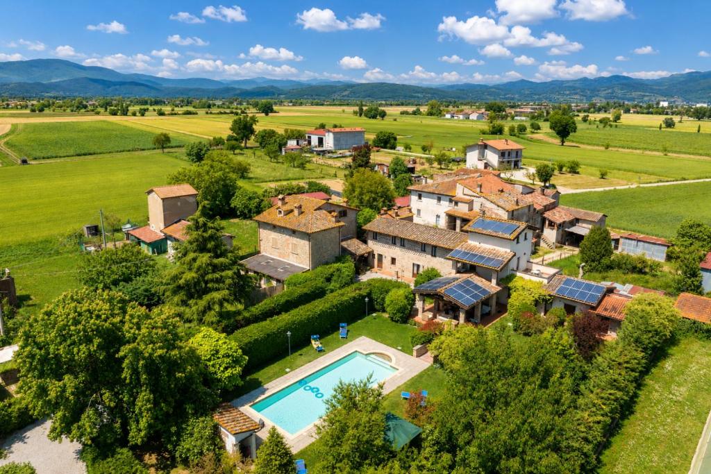 an aerial view of a estate with a swimming pool at Casale Tiziano by PosarelliVillas in Citerna